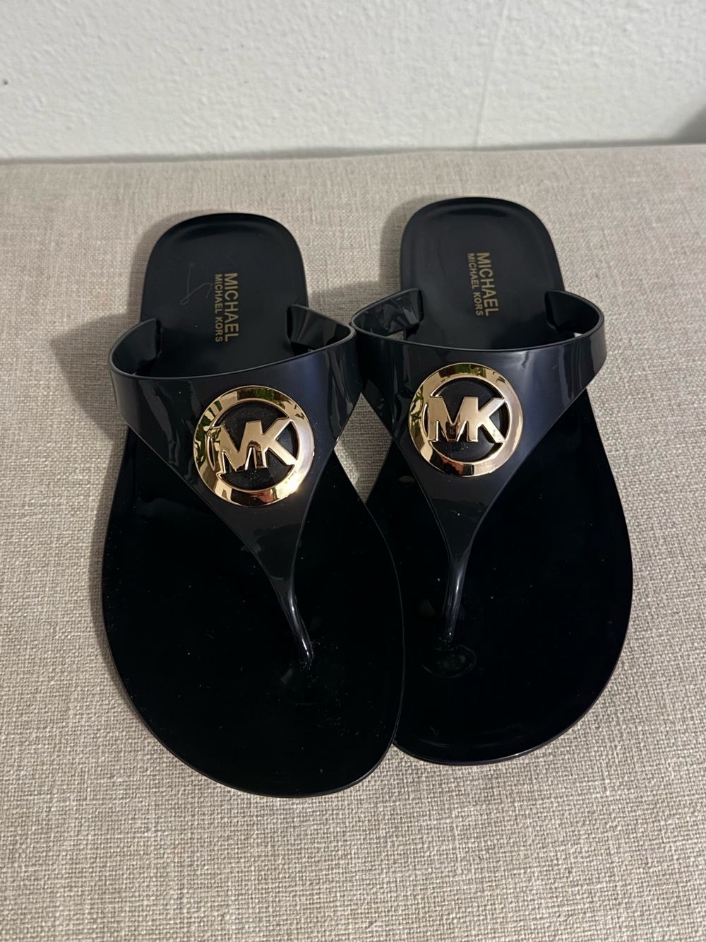 Michael Kors Black Lillie Jelly Thong Sandals with Gold MK Medallion